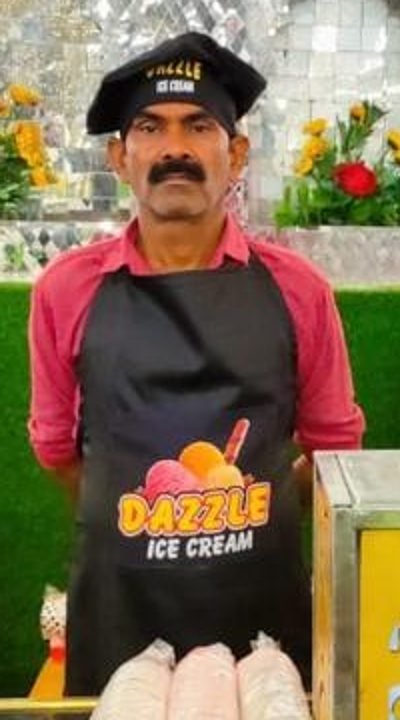 Dazzle server in apron and cap